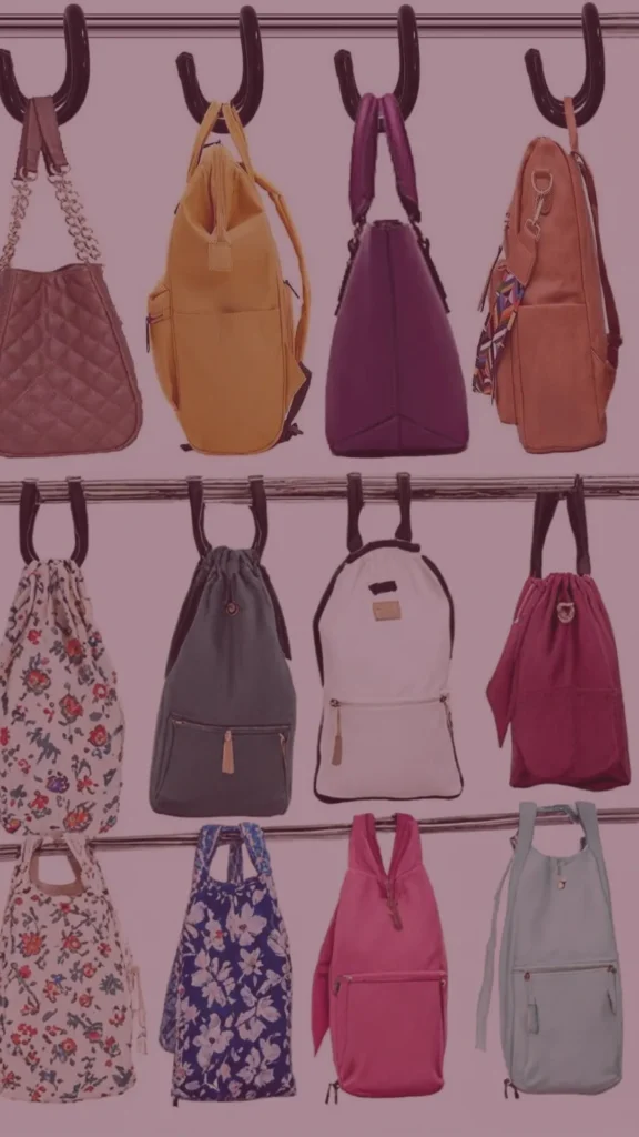A beautifully organized minimalist closet showing a row of luxury handbags hung uniformly on thin velvet hangers with clips along a clothing rod. The purses, arranged in a tidy sequence, feature premium leather materials in neutral shades of beige, brown, black, and white. The background shows structured shelving with neatly folded clothes under soft, warm lighting.